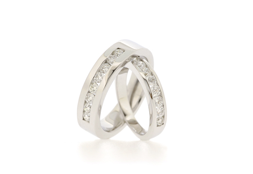 Pair of Diamond Eternity Rings His in Sterling Silver hers in 18K White 