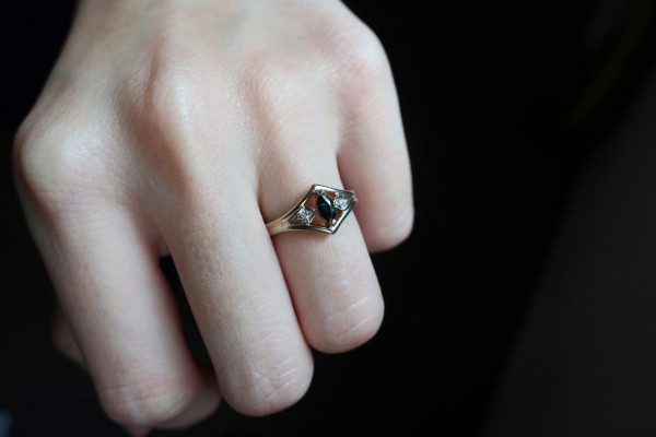 Custom designed engagement ring worn on finger